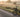 Classic electric tricycle on a quiet country road at sunrise