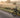 Classic electric tricycle on a quiet country road at sunrise
